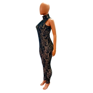 Close-up of black floral lace jumpsuit with nude lining and intricate hollow-out details