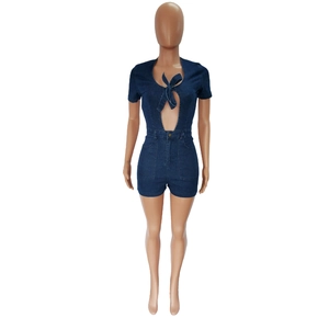 Detail of dark blue denim romper with V-neck bow tie and stylish cutout design