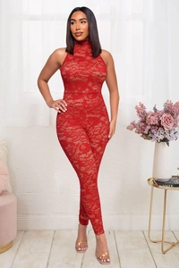 Close-up of red lace jumpsuit featuring halter neck design and floral crochet texture