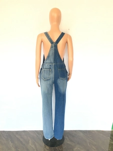 Rear view of two-tone denim overalls featuring a unique blue patchwork design with back pockets