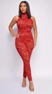 Detailed texture of red lace jumpsuit featuring high neck and floral hollow patterns