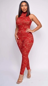Close-up of intricate red floral lace fabric on a slimming sleeveless catsuit with high neck