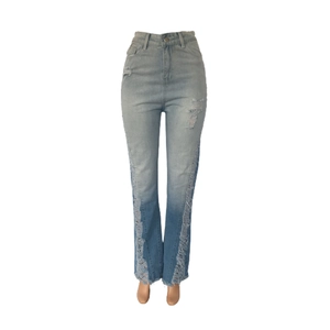 Detail of light blue high waist flare jeans featuring distressed ripped frayed side edges