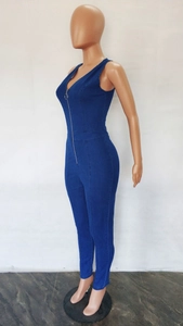 Detail view of deep blue denim jumpsuit showing slim fit cut and front metal ring zipper