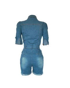 Back view of mid-blue denim romper on mannequin with short sleeves and belt loops