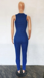 Detail view of the slim-fit dark blue denim jumpsuit with back zipper and vertical seams