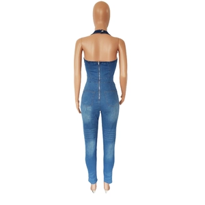 Rear view of halter neck denim jumpsuit featuring back zipper closure and washed details