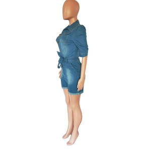 Close-up of slim fit dark blue washed denim romper with collar and waist belt detail
