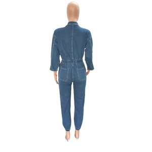 Detail view of denim jumpsuit back with elastic waist, long sleeves and patch pockets