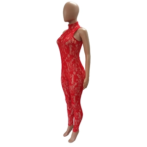 Detail view of red lace jumpsuit featuring high collar and sleeveless slim-fit texture