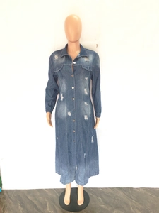 Detail of distressed long denim trench coat with metal buttons and ripped accents