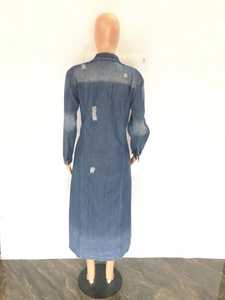 Detailed back view of a long denim jacket featuring distressed ripped hole details