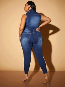 Detail view of the deep blue denim jumpsuit back featuring two functional pockets