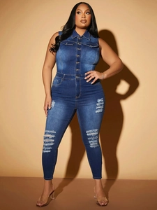 Close-up of distressed denim jumpsuit with metal buttons and ripped knee detail