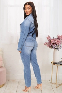 Detailed back view of light blue washed denim jumpsuit with elastic waist and pockets