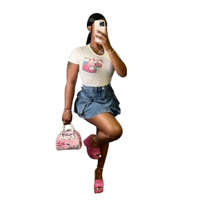 Slim fit denim mini skirt with utility pockets paired with a white graphic print T-shirt