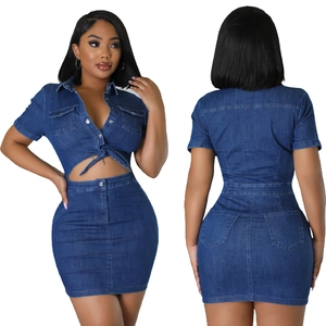 Front and back view of a two-piece dark wash denim set with crop top and mini skirt