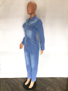 Detailed side view of light blue denim jumpsuit with elastic waist on mannequin