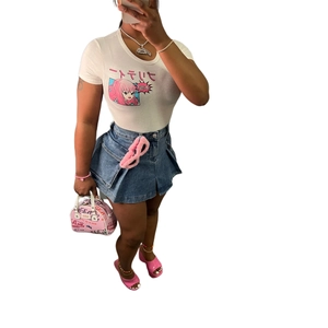 Detail of slim-fit denim mini skirt with large flap pocket and anime print white T-shirt