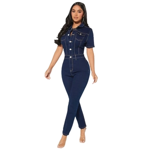 Detailed view of dark blue denim jumpsuit with short sleeves and double breast pockets