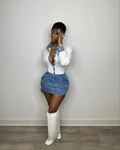 Slim fit denim dress ensemble with white puff boots and contrast pocket details