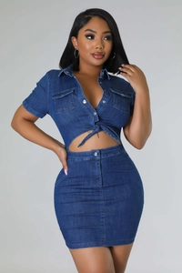 Detailed view of dark blue denim two-piece set with tie-waist detail and metal buttons