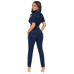 Detail of dark blue denim jumpsuit with short sleeves, collar and contrast stitching