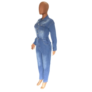 Side view of women's denim jumpsuit featuring elastic waist and dual chest pockets
