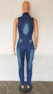 Rear view of slim fit sleeveless denim jumpsuit with back pockets and faded wash