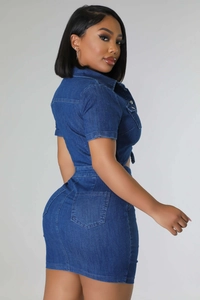 Detail view of the slim fit denim two-piece set showing back pockets and metal buttons