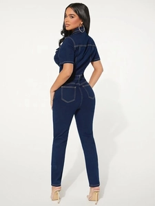 Slim fit dark blue denim jumpsuit featuring short sleeves and detailed white stitching