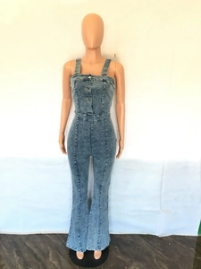 Detail of light blue denim jumpsuit with button front, high waist and flared leg cut