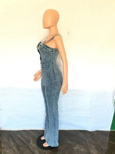 Side view of slim fit denim jumpsuit for women featuring flared legs and adjustable straps
