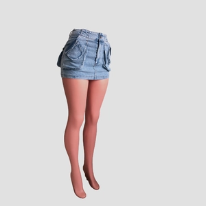 Detail of light blue washed denim mini skirt featuring large cargo style flap pockets