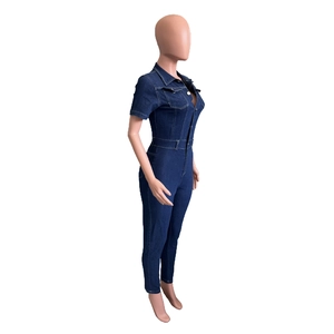 Detail view of the slim fit dark blue denim jumpsuit with short sleeves and lapel collar