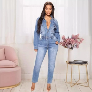 Slim fit light blue wash denim jumpsuit with long sleeves, elastic waist, and button front