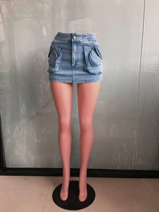 Detail of light blue denim mini skirt featuring large cargo pockets and contrast stitching