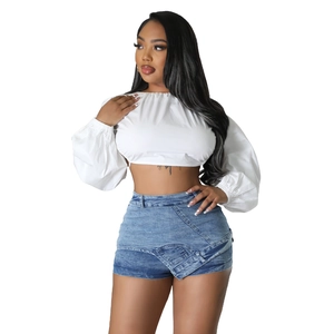 Women's white lantern sleeve crop top paired with blue overlap denim shorts set