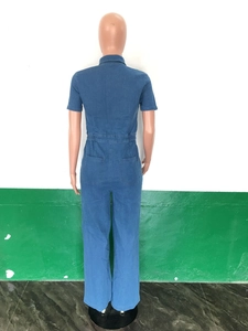 Rear view of blue denim jumpsuit featuring short sleeves, lapel collar and elastic waist