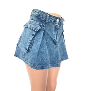 Detailed view of dark blue denim mini skirt featuring large utility cargo pockets and metal buckle