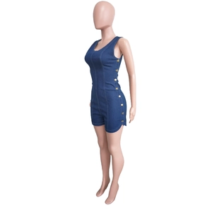Close-up of deep blue denim romper featuring decorative gold side buttons and slim fit cut