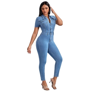 Close-up of slim fit denim jumpsuit featuring a button-up front and chest pocket detail