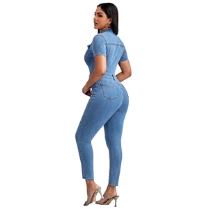 Rear view detail of blue slim fit denim jumpsuit showing back pockets and bodycon fit