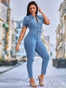 Close-up of slim fit denim jumpsuit with metal buttons and chest pockets details