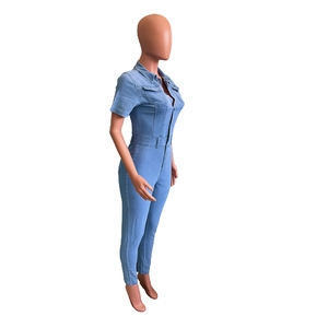 Slim fit light blue denim jumpsuit with short sleeves and metal buttons side view