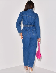 Back view of long sleeve denim jumpsuit featuring elastic waist and rear pockets