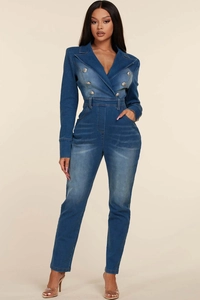 Close-up of double-breasted silver buttons and lapel on dark blue denim jumpsuit