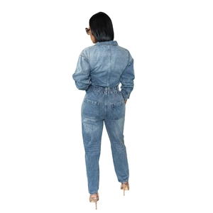 Back view of light blue washed denim jumpsuit with elastic waist and dual rear pockets
