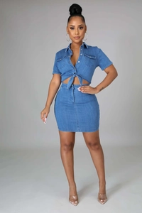 Detail view of light blue denim two-piece set featuring tie-front shirt and mini skirt