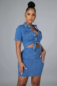 Close-up of sexy blue denim two-piece set featuring short sleeve tie-waist top and mini skirt